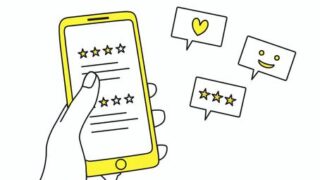 「スマートフォンでレビュー評価を確認する手のイラスト。星評価やハート、笑顔マークなどの口コミアイコンが表示されており、ユーザーのレビューや体験談、SNSの評判を視覚的に表現」
